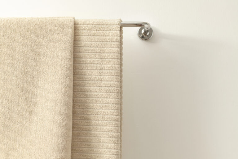 Towel hanging in bathroom, home textile